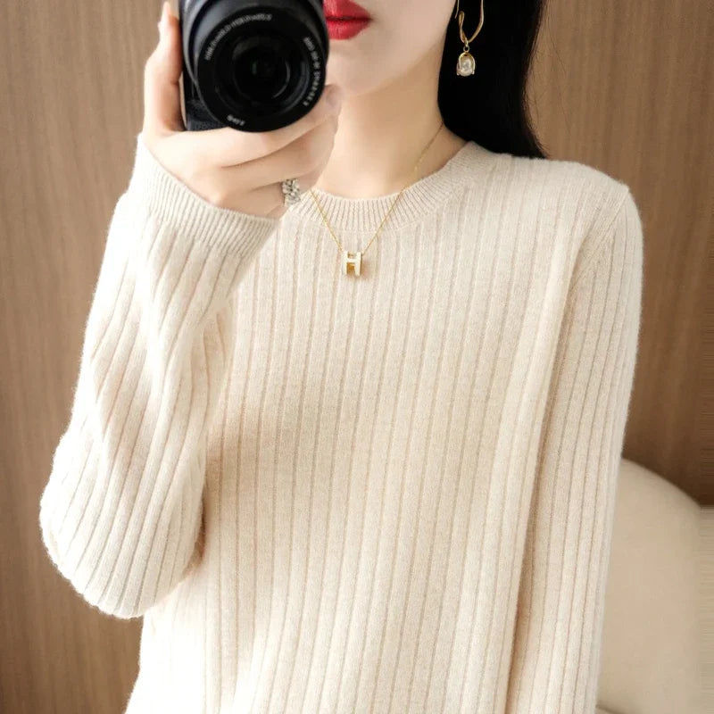 Striped winter sweater with a classic O-neck, long sleeves, and an elegant, modern design.