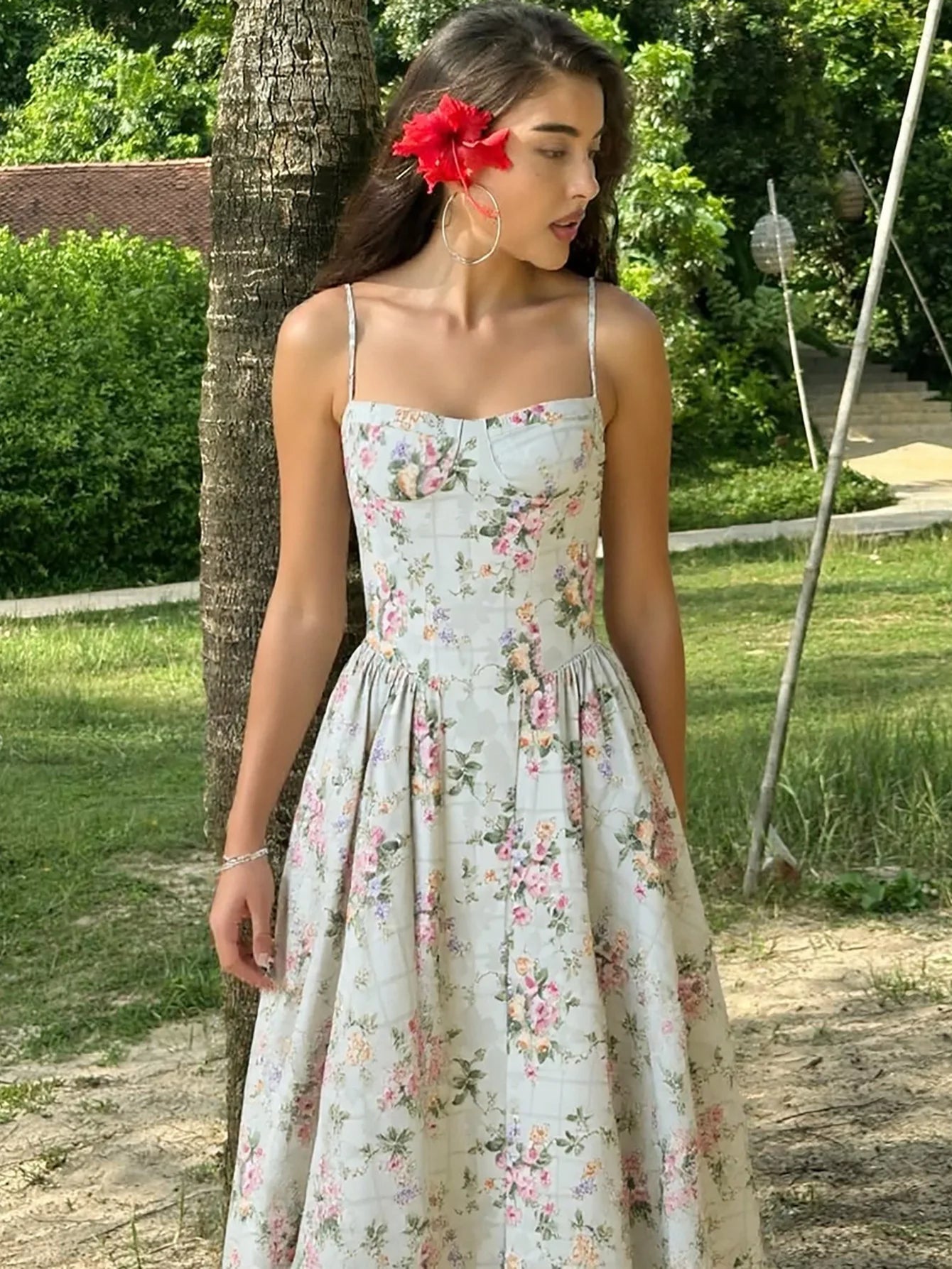 Vintage floral midi dress with a high waist and A-line silhouette, sundress style, perfect for daytime wear and evening events, available in white.