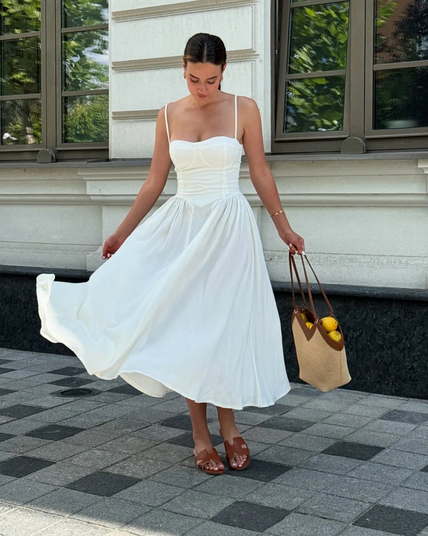 Vintage floral midi dress with a high waist and A-line silhouette, sundress style, perfect for daytime wear and evening events, available in white.