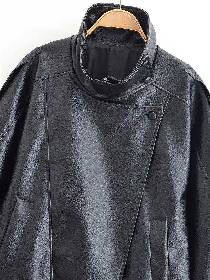 Black jacket in refined faux leather, modern cut and striking style.